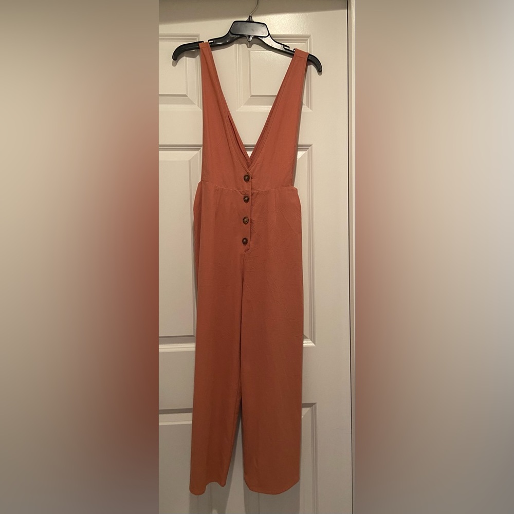 Wide-leg buttoned down v-neck jumpsuit.